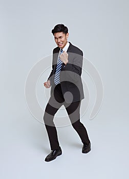 Portrait of young Asian businessman happy and success isolated on studio white background