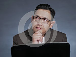 Young Man With Laptop, Thinking Seriously