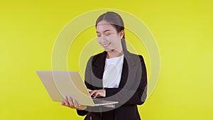 Portrait young asian businesswoman using laptop and think idea for planning and decide with successful.