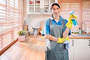 Portrait of a young Asian cleaning service woman worker working in house. Girls housekeeper cleaner, holding foggy spray.