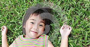 Portrait of young asian girl having good time in the park