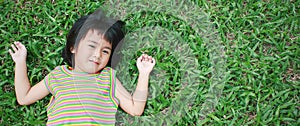 Portrait of young asian girl having good time in the park