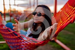 Portrait Of A Young Asian Girl Lying In A Hammock