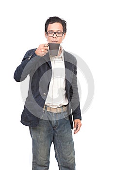 Portrait of young asian man drinking hot drink in coffee mug cup