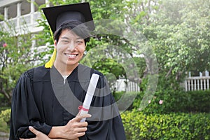 Portrait of young asian man outside on his graduated day