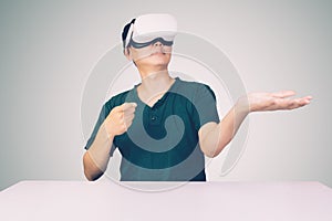 Portrait of young asian man wearing goggles virtual reality with excited isolated on white background.