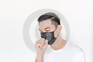 Portrait of young Asian Man wearing mask protect fine dust in air pollution environment