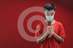 Portrait of  young Asian man wearing protective mask against the coronavirus