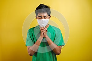 Portrait of young Asian man wearing protective mask against the coronavirus