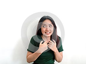 Portrait of young asian people posing shocking and surprising action on white background with free copy space