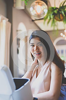 Portrait young Asian pretty business woman smiling and looking camera