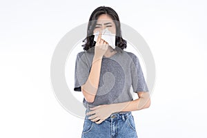 Portrait of young Asian woman blowing running nose got flu caught cold sneezing in tissue. Her sick allergic having allergy