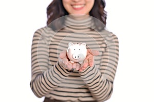 Portrait of young Asian woman casual uniform holding white piggy bank isolated on white background, Financial and bank saving