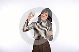 Portrait of young Asian woman casual uniform holding white piggy bank isolated on white background, Financial and bank saving