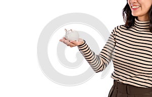 Portrait of young Asian woman casual uniform holding white piggy bank isolated on white background, Financial and bank saving