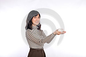 Portrait of young Asian woman casual uniform holding white piggy bank  on white background, Financial and bank saving