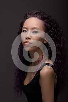 Portrait of young asian woman with curly hair