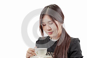 Portrait of young Asian woman drinking her morning coffee.