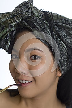 Portrait of young Asian woman with headscarf