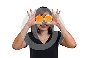 Portrait of young Asian woman. holding orange slices in front of her eyes and smile isolated on white background