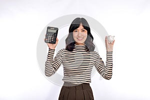 Portrait of young Asian woman casual uniform holding white piggy bank and calculator isolated on white background, Financial and