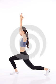 Portrait young asian woman in sportswear doing practice yoga for stretch hands isolated white background.