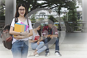 Portrait of Young Asian woman student and friends are tutoring e