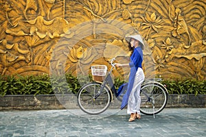 Young asian woman in traditional vietnamese dress ao dai photo