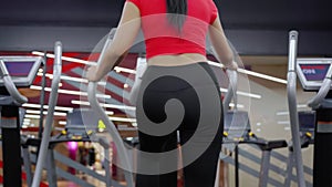 Portrait young asian woman walking on treadmill in fitness gym, cardio exercise, sport and training.