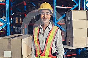 Portrait of young Asian woman warehouse worker smiling in the storehouse