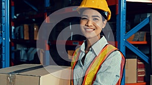 Portrait of young Asian woman warehouse worker smiling in the storehouse