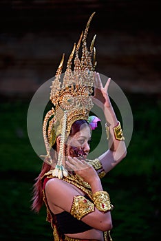 Portrait of a young Asian woman wearing an Apsara dress with ghost face makeup