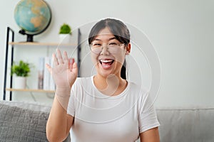 Portrait of young Asian woman wearing eye glasses smiling and looking at camera