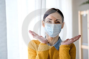 Portrait of young Asian woman,  wearing a medical surgical disposabhttpsle face mask to prevent infection