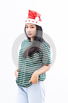 Portrait of a young asian woman wearing a santa hat with a white isolated background