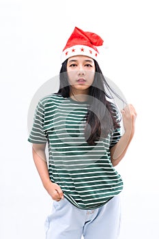 Portrait of a young asian woman wearing a santa hat with a white isolated background