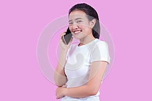 Portrait of young asian woman wearing white shirt successful talking phone call on smartphone and happy smile isolated