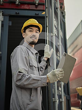 Portrait of young Asian worker wearing safety helmet