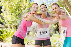 Portrait of young athlete women forming huddles