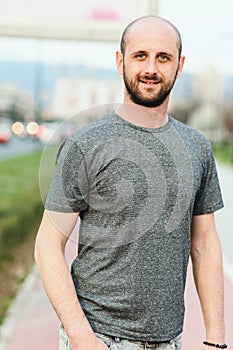 Portrait of young atractive man enjoying his day outside