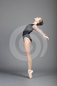 Portrait of young attractive ballerina posing