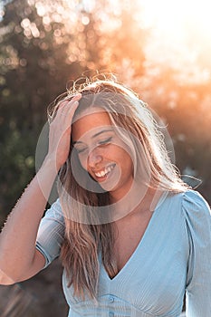 Portrait of a young and attractive caucasian woman near a forest