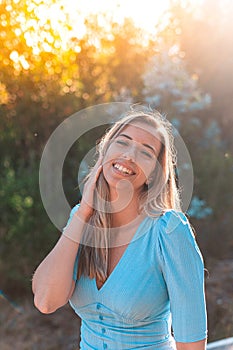 Portrait of a young and attractive caucasian woman near a forest