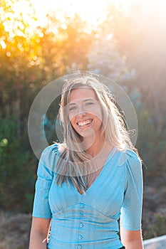 Portrait of a young and attractive caucasian woman near a forest