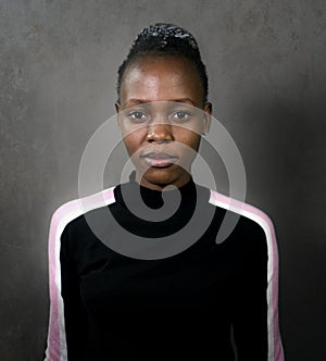 Portrait of young attractive and confident black African American woman posing in cool attitude looking at the camera isolated on