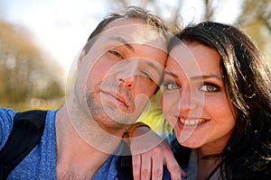 Portrait of young attractive couple having emotional fun tomfoolery together.