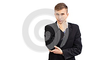 Portrait of young attractive doubting business man in a dark suit and a bright blue tie, isolated on white