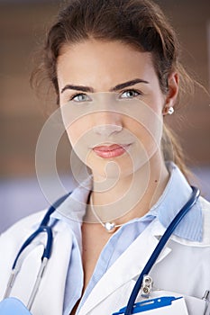 Portrait of young attractive female doctor smiling