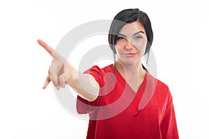 Portrait of young attractive female nurse making denial gesture