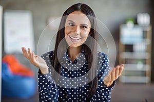 Portrait of young attractive happy positive cheerful good mood smiling businesswoman on job interview at office